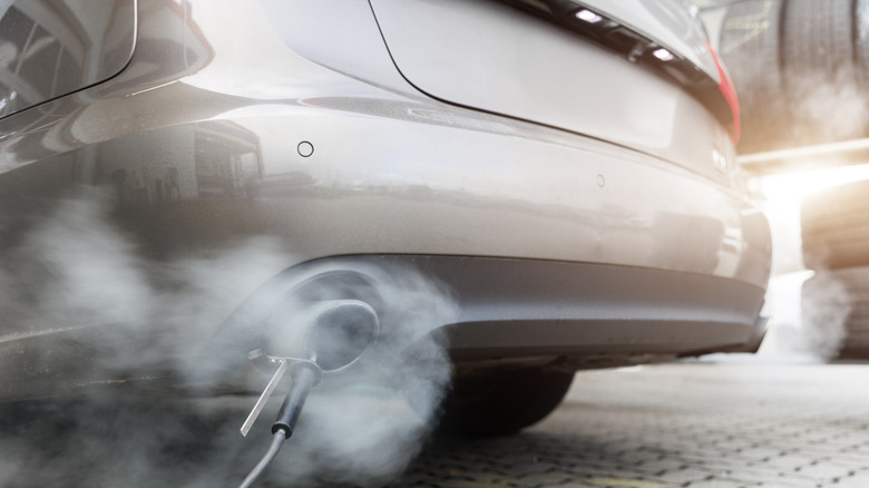 A car being measured for tailpipe emissions.