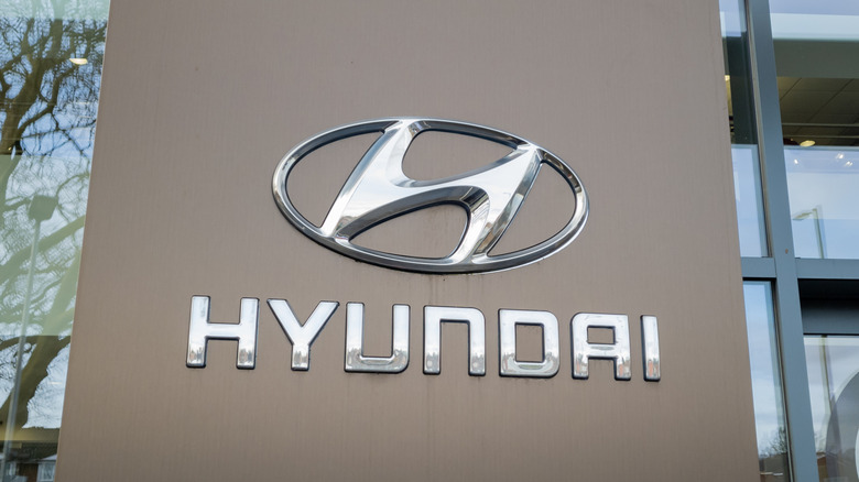 A Hyundai Motors dealership bearing the South Korean vehicle manufacturer,s name sign and logo.