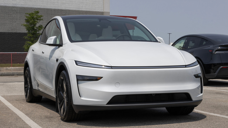 Tesla Model Y display at a dealership. Tesla offers the Model Y with up to 327 miles of driving range.