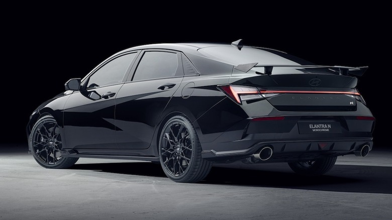 Rear 3/4 of a black Hyundai Elantra N Monochrome.