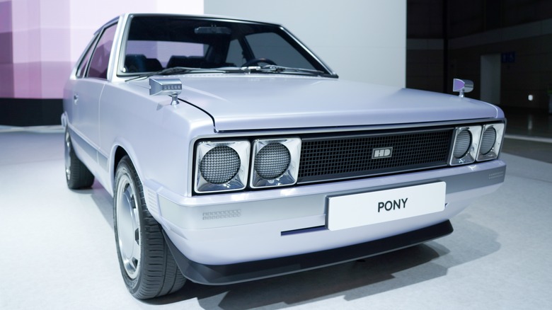 An electric Hyundai Pony with an HD logo