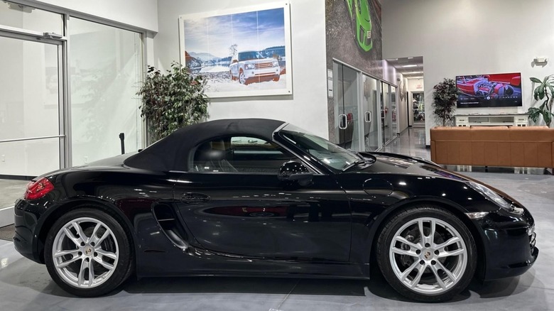 Black 2013 Porsche Boxster in profile