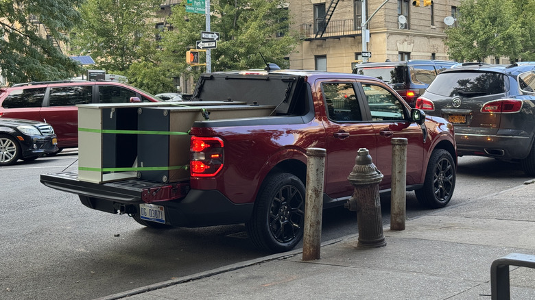 A Ford Maverick with its bed full of shelving