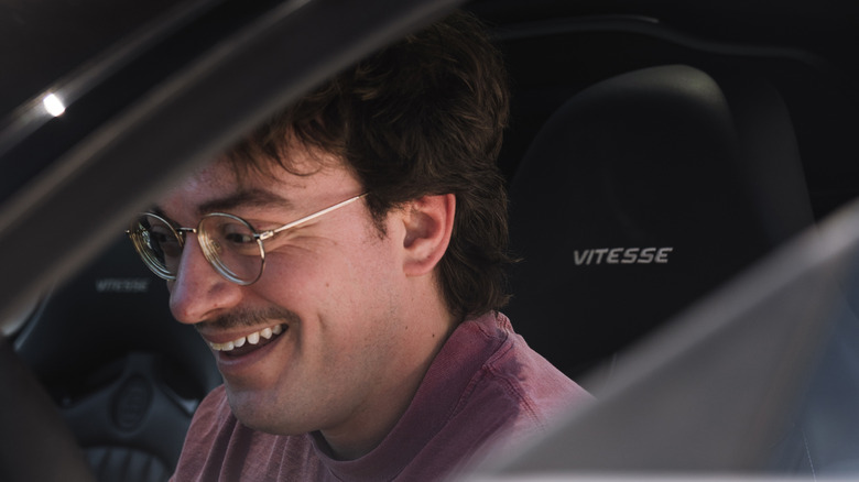 The author smiling while sitting in a Bugatti Veyron Grand Sport Vitesse