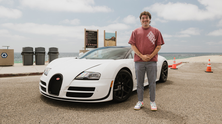 The author standing in front of a white Bugatti Veyron Grand Sport Vitesse