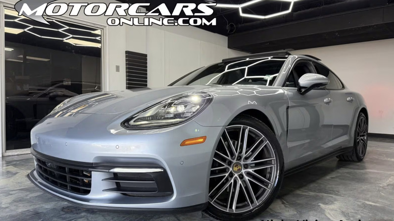 A 2019 Porsche Panamera 4 is parked in front of the dealership