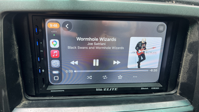An Apple Carplay head unit installed in a 2006 Toyota 4Runner, playing Joe Satriani