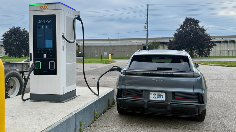 Rear view of a Porsche Cayenne Electric charging at a 400-kW station.