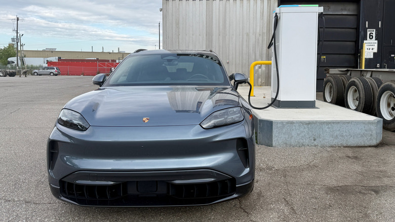 Front view of a Porsche Cayenne Electric charging at a 400-kW station.