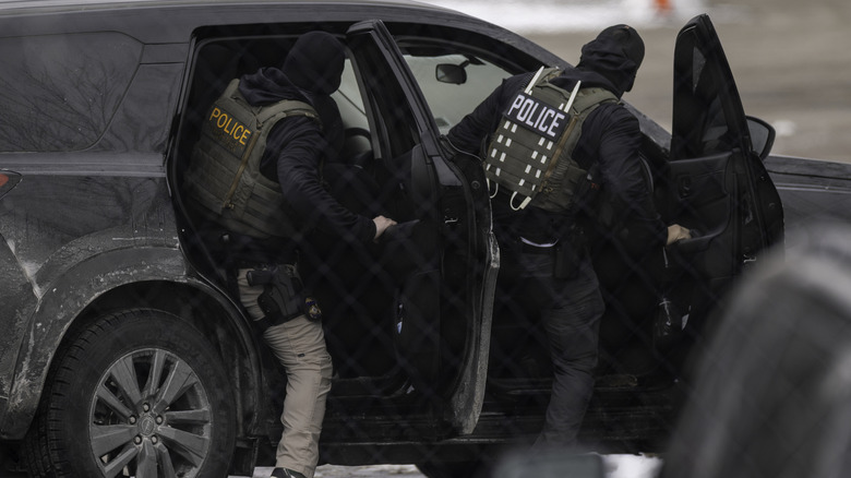 ICE agents depart the Bishop Henry Whipple Federal Building on February 4, 2026 in Minneapolis, Minnesota.