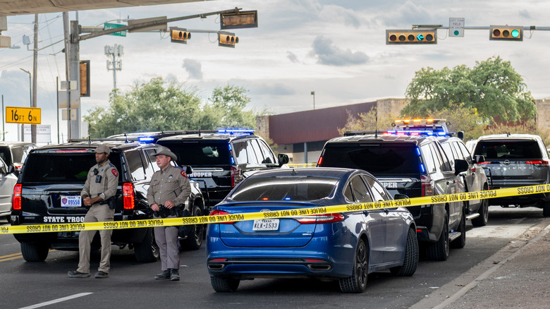 Law enforcement monitor a vehicle that was shot at by Immigration and Customs Enforcement officers on September 20, 2026 in Austin, Texas.