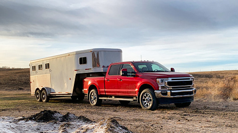 Truck hauling a large horse trailer fifth wheel