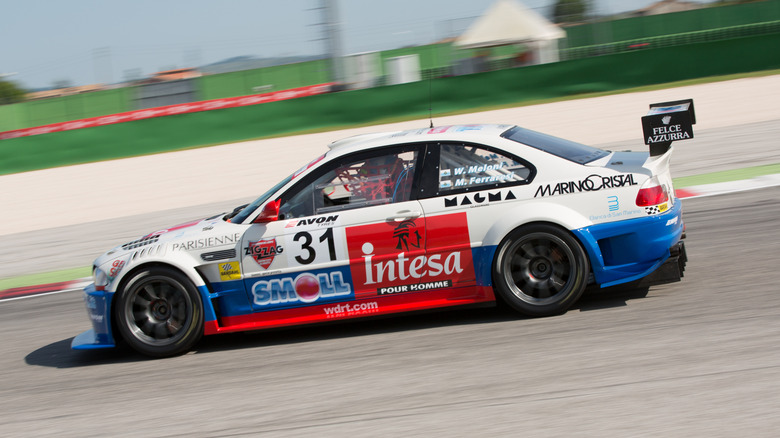A BMW M3 E46 with straight cut gears driving quickly during an endurance race