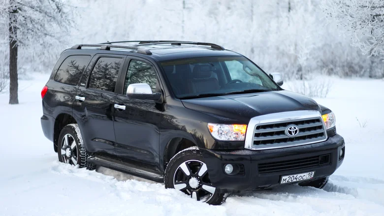 A black Toyota Sequoia in the snow.