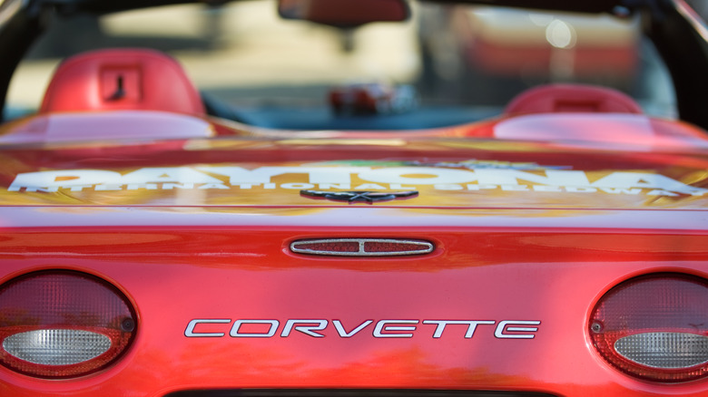 A close-up of a rear-end of a red Corvette convertible