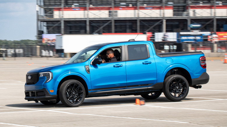 A blue Ford Maverick SV300T on an autocross.