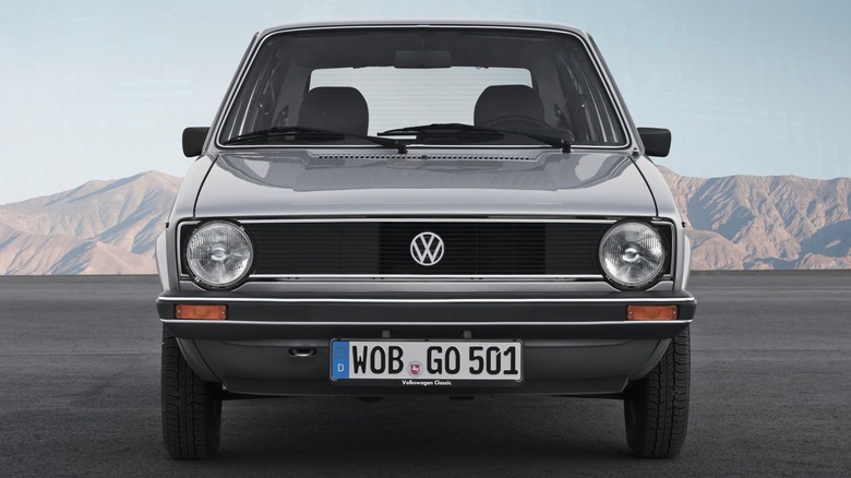 A Mk1 VW Golf parked in the desert.