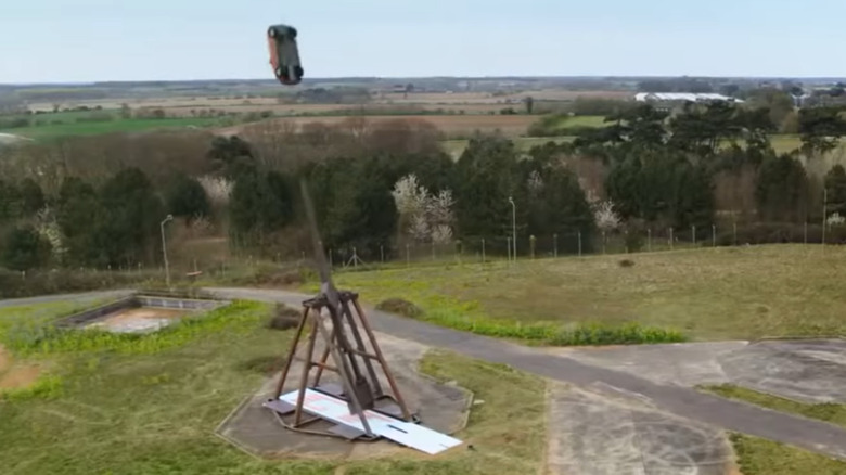 If You're Having A Hard Day, Just Watch These Cars Get Trebucheted
