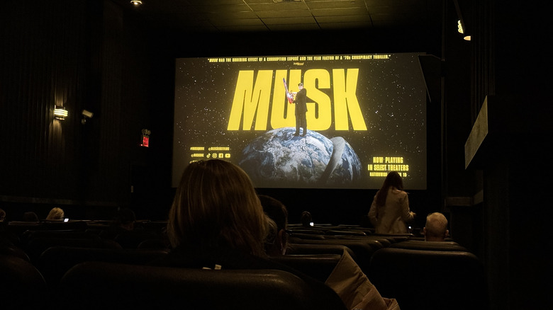 Theater screen showing a promo image for "Musk"