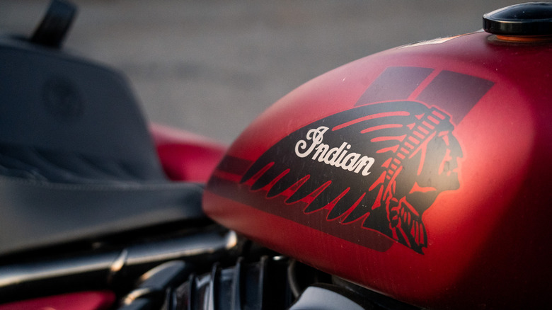 Closeup of an Indian Sport Chief RT motorcycle tank at sunset