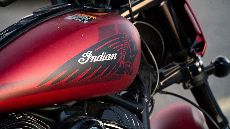 Closeup of an Indian Sport Chief RT motorcycle tank at sunset