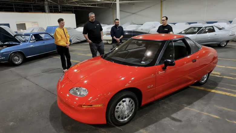 The Questionable Garage crew examining the first GM EV1 to roll off the production line