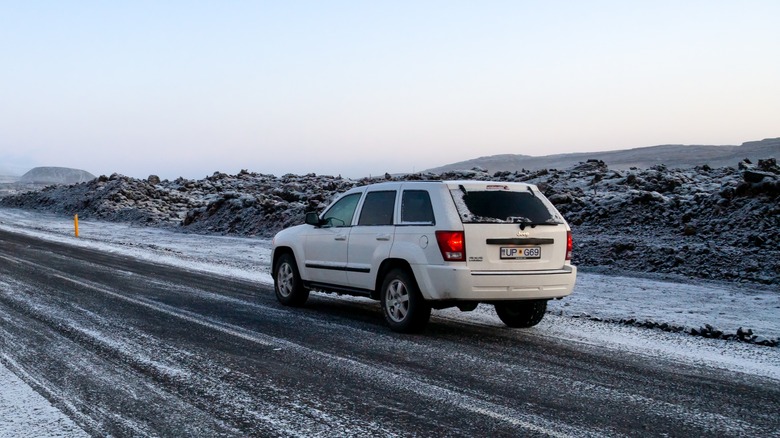 Jeep Grand Cherokee driving on the Iceland's Ring Road during winter.