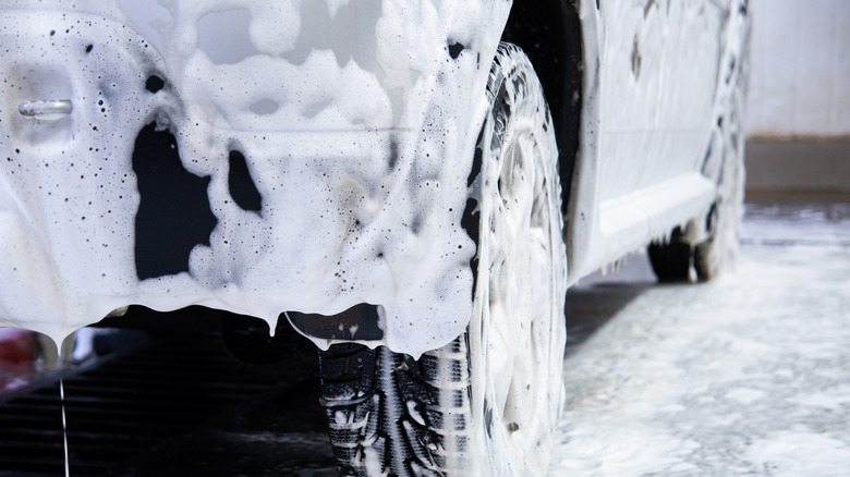 Washing a car pinch snowfall foam and car shampoo