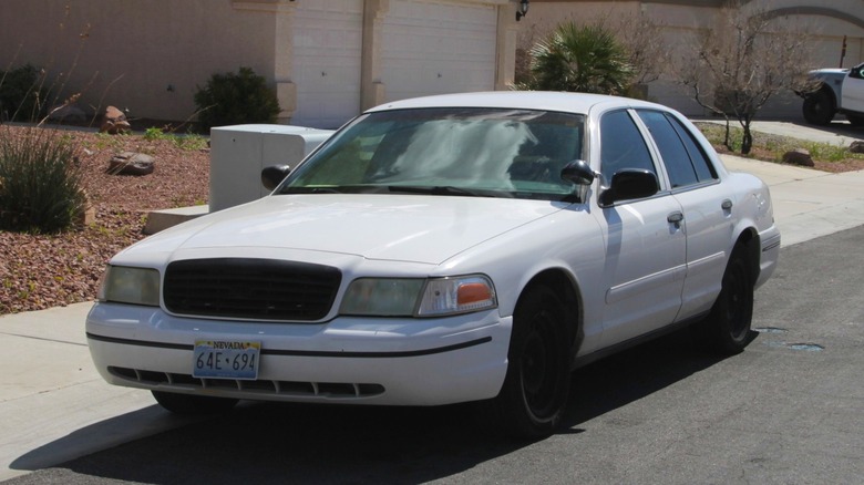 A white retired Ford Crown Victoria PPV.