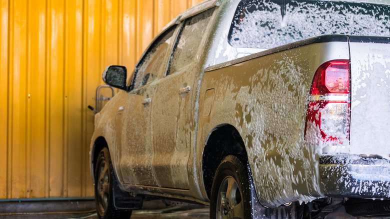 Cleaning a compact pickup truck at a local car wash
