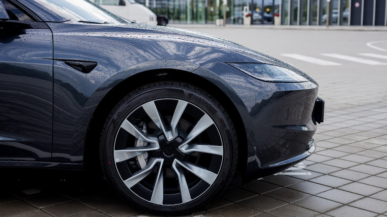 A Tesla Model 3 showing its front wheel