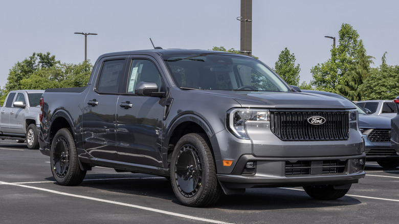A gray Ford Maverick in a parking lot.