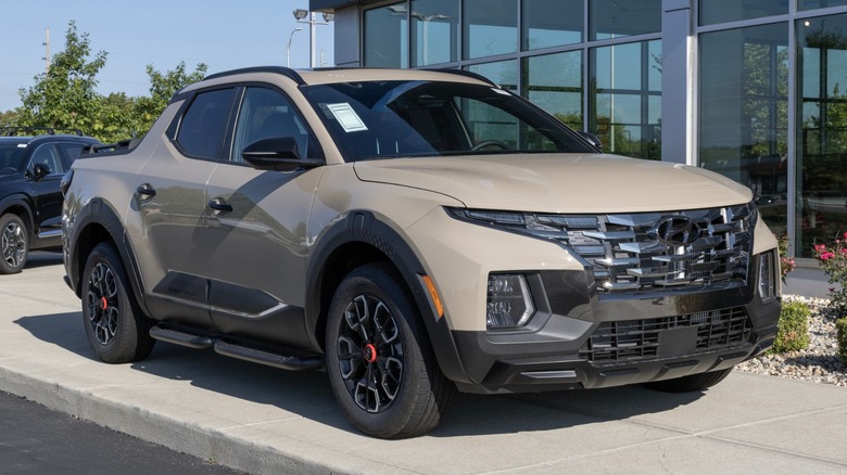 a tan Hyundai Santa Cruz at a dealership.