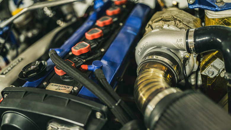 An inline-six engine featuring an upgraded turbocharger, custom intake and turbo blanket.