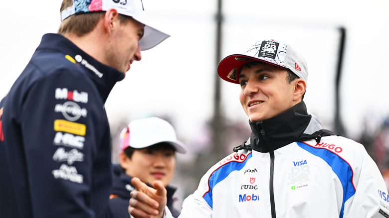 Max Verstappen of the Netherlands and Oracle Red Bull Racing with Isack Hadjar of France and Visa Cash App Racing Bulls on the drivers parade prior to the F1 Grand Prix of Japan at Suzuka Circuit on April 06, 2025 in Suzuka, Japan.
