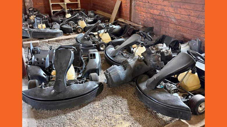Eight go karts in a garage