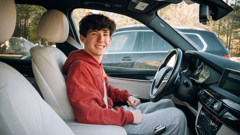 Photo of a teenage boy in the driver's seat