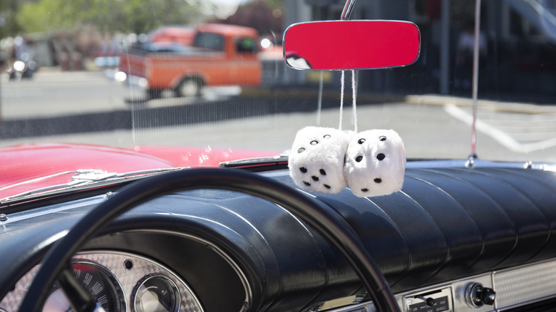 Fuzzy dice hanging from rearview mirror