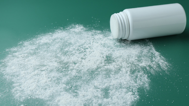 A spilled talcum powder container