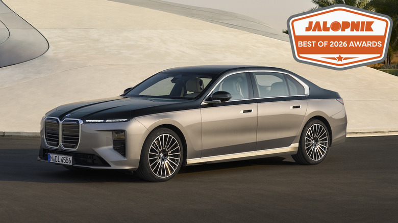 BMW 7 Series parked in front of a modern art building