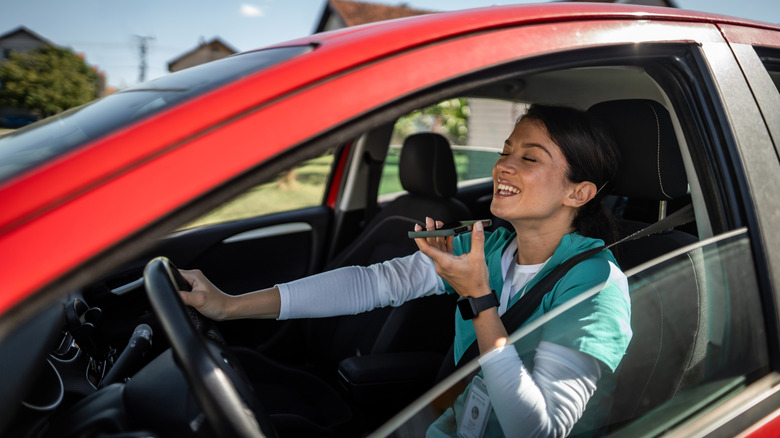 A woman talking on the phone while driving