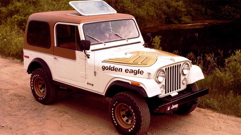 White 1979 Jeep CJ-7 in Golden Eagle trim front right view seen on a dirt trail