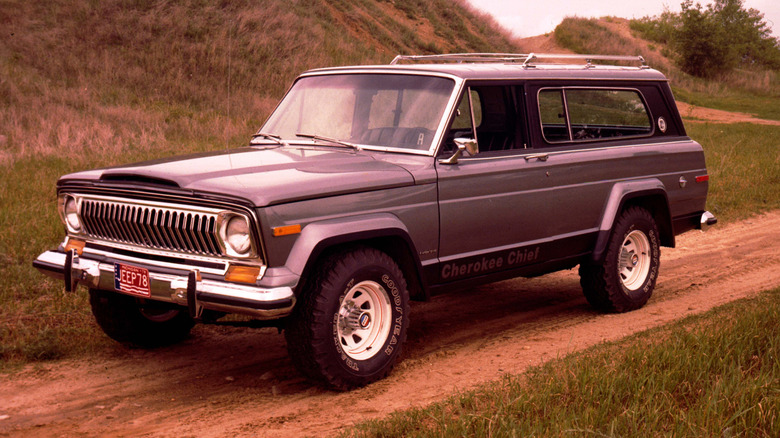 Gray 1978 Jeep Cherokee Chief SUV front left view on a dirt trail