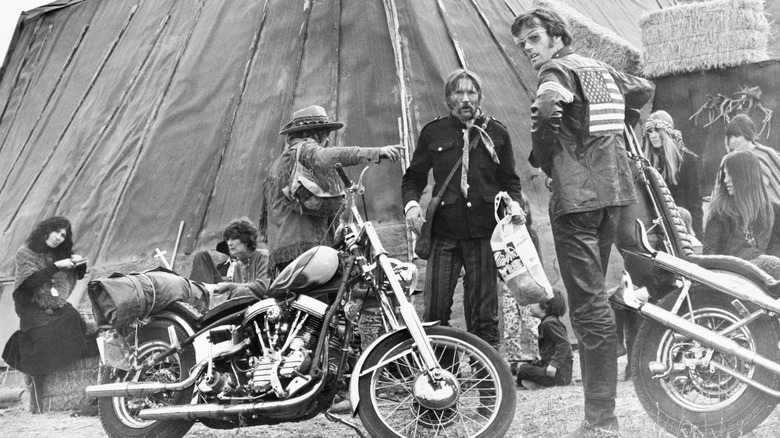 Dennis Hopper sets up the scene where he (as Billy) and Peter Fonda (at right, as Wyatt), bid good bye to the Stranger (Luke Askew, center), as they leave the Hippie Commune in Arroyo Hondo.