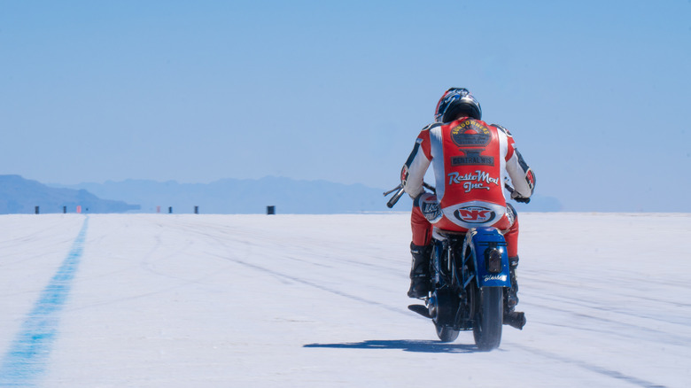 A motorbike driving across the Bonneville Salt Flats