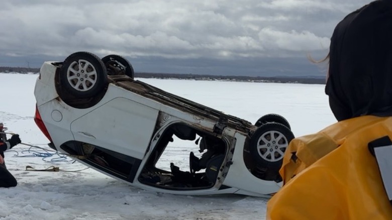Authorities attempt to retrieve a Hyundai Accent that was abandoned on ocean ice after getting stuck
