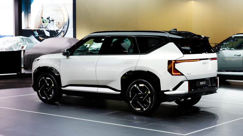 Rear 3/4 view of a white Kia EV5 GT