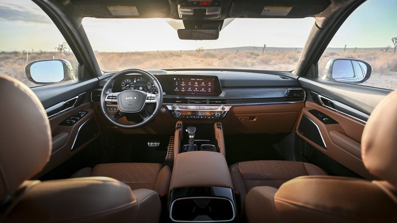 Interior view of a 2024 Kia Telluride, looking forward between the two front seats
