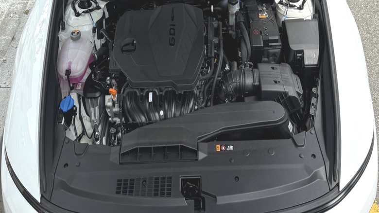 A look under the hood of my white Grandeur press car showing the naturally aspirated four-cylinder engine