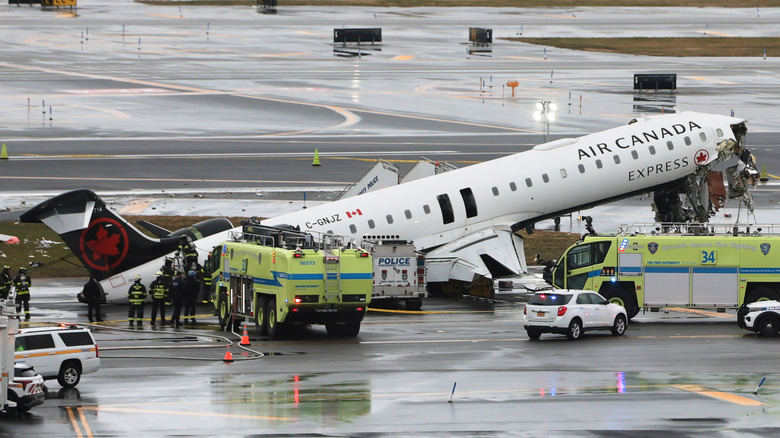 An Air Canada Express CRJ-900 sits on the runway after colliding with a Port Authority fire truck at LaGuardia Airport on March 23, 2026 in New York City.